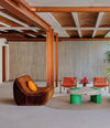 Vibe Lounge Chair by Sancal in brown in a lounge with palms – In Dubai by WSPR