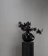 Wabi Vase, Medio by 101 Copenhagen in Smoked Forest in a styled interior – In Dubai by WSPR