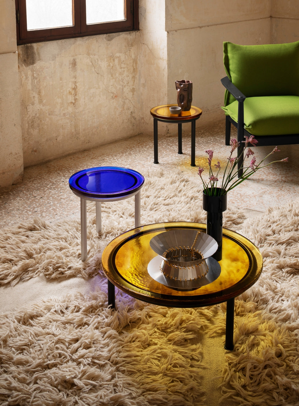 Zigo Coffee Table by Miniforms with Yellow Amber cast glass, both sizes styled on a shaggy rug – In Dubai by WSPR